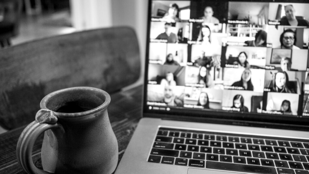 Macbook pro displaying group of people.