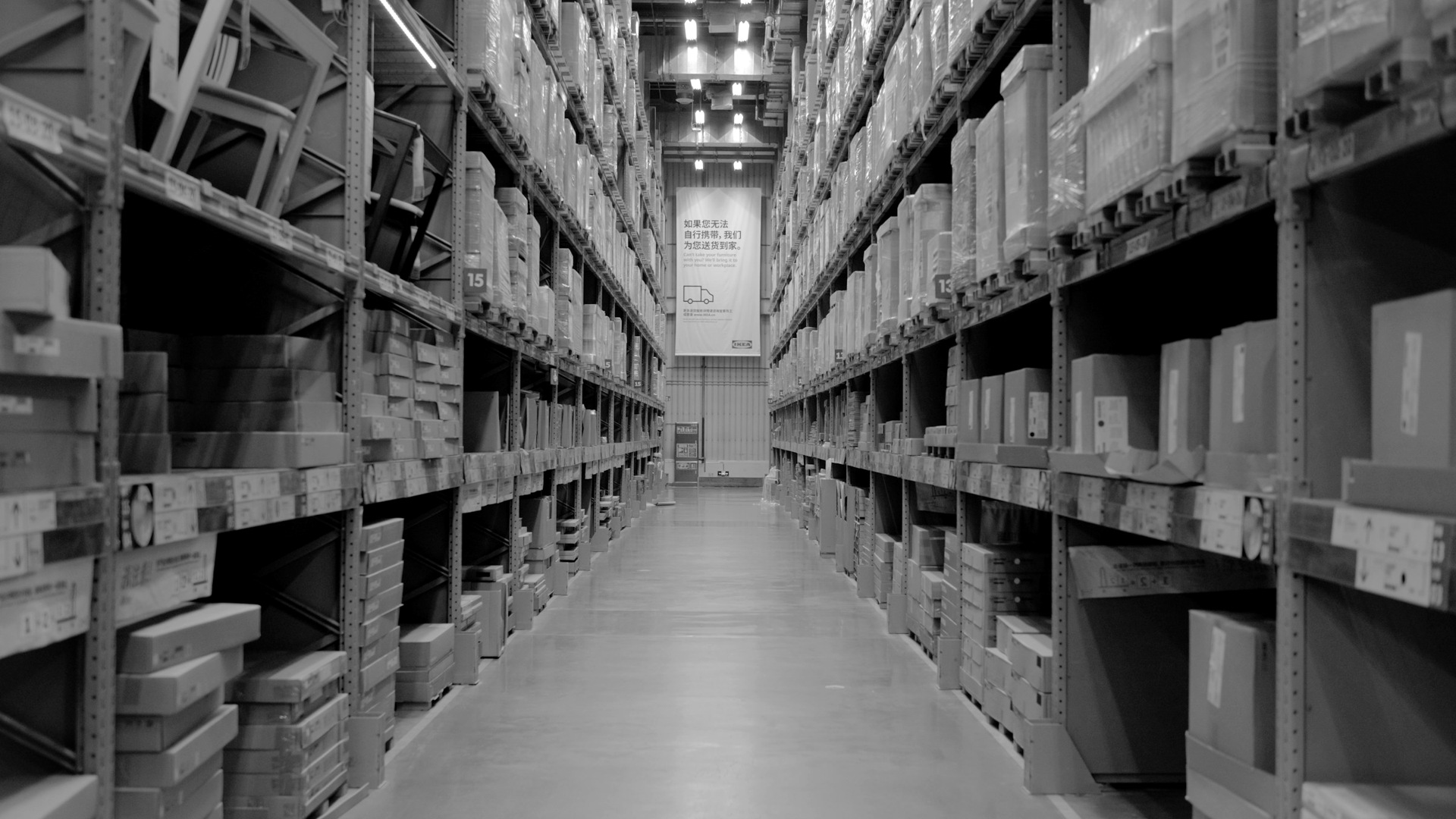 A large warehouse filled with lots of shelves.