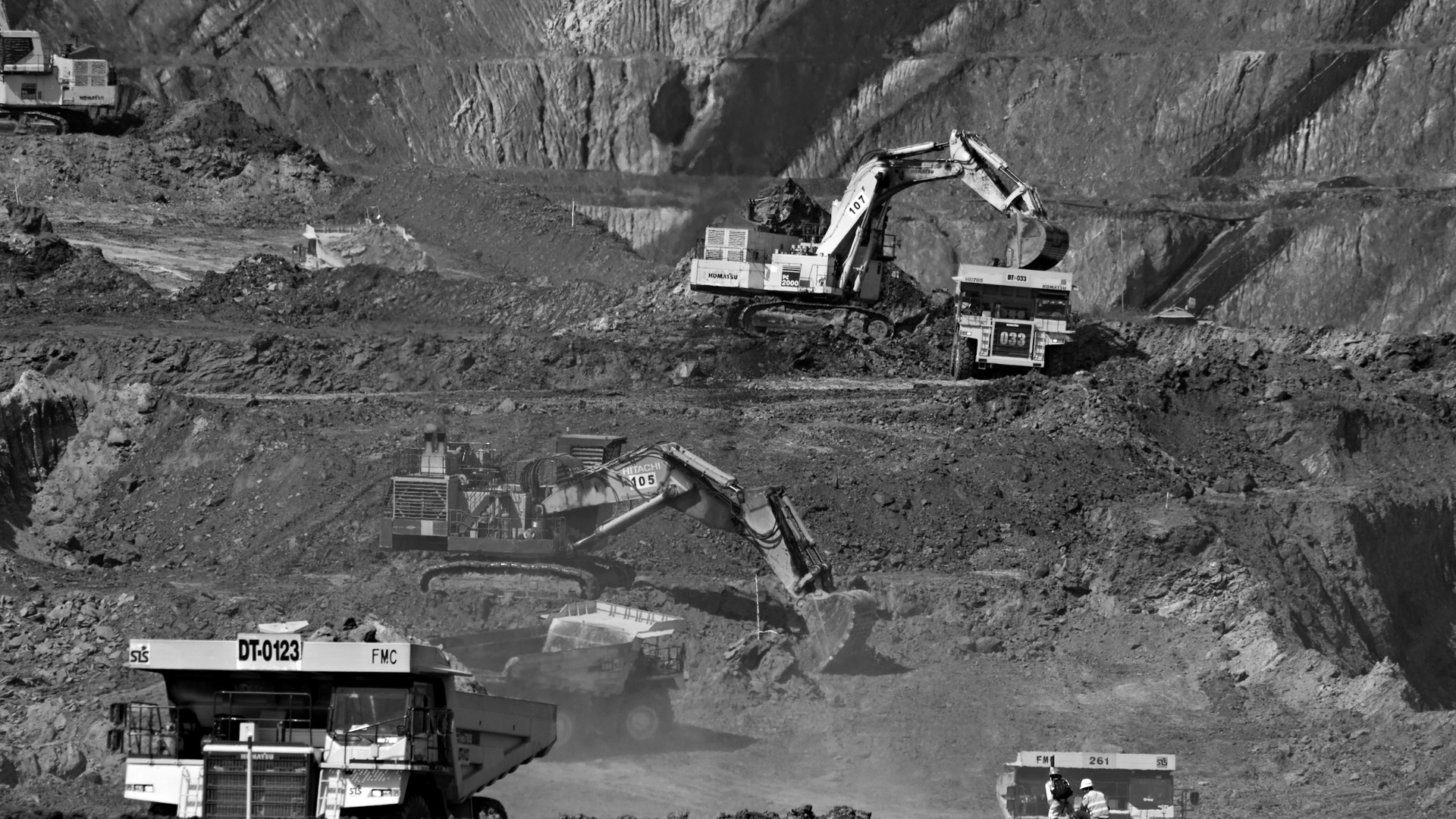 Photography of excavators at mining area.