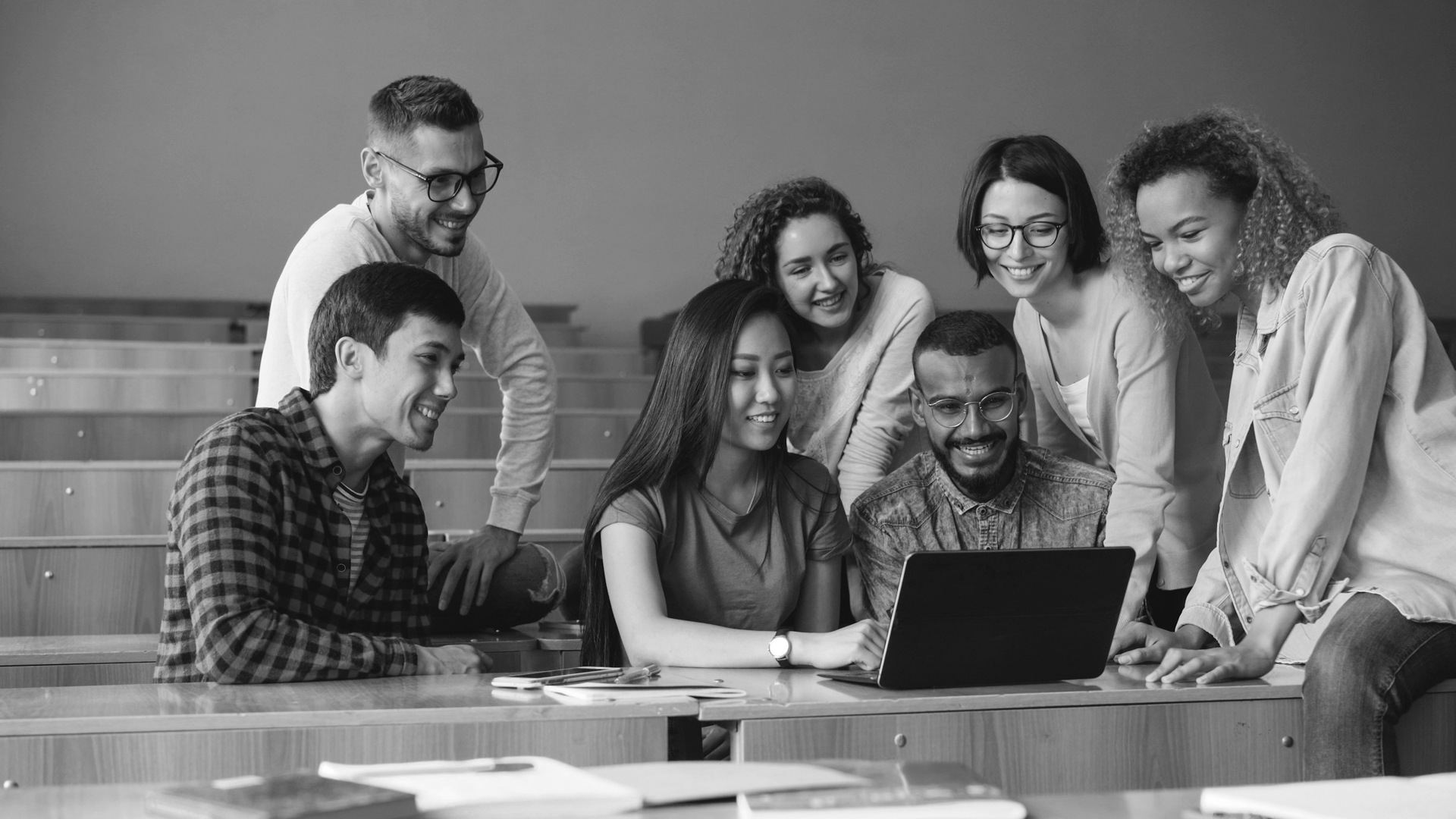 EdTech marketing & GTM growth: institutional purchases and educator-led adoption 1 Diverse group of students collaborating around a laptop.