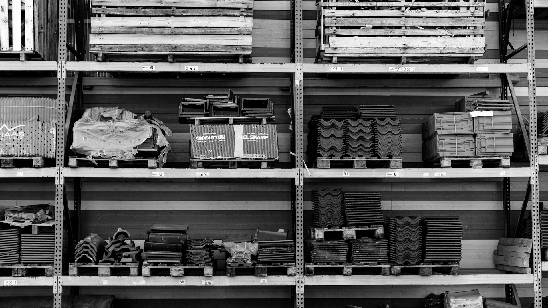 A shelf filled with lots of different types of bricks.
