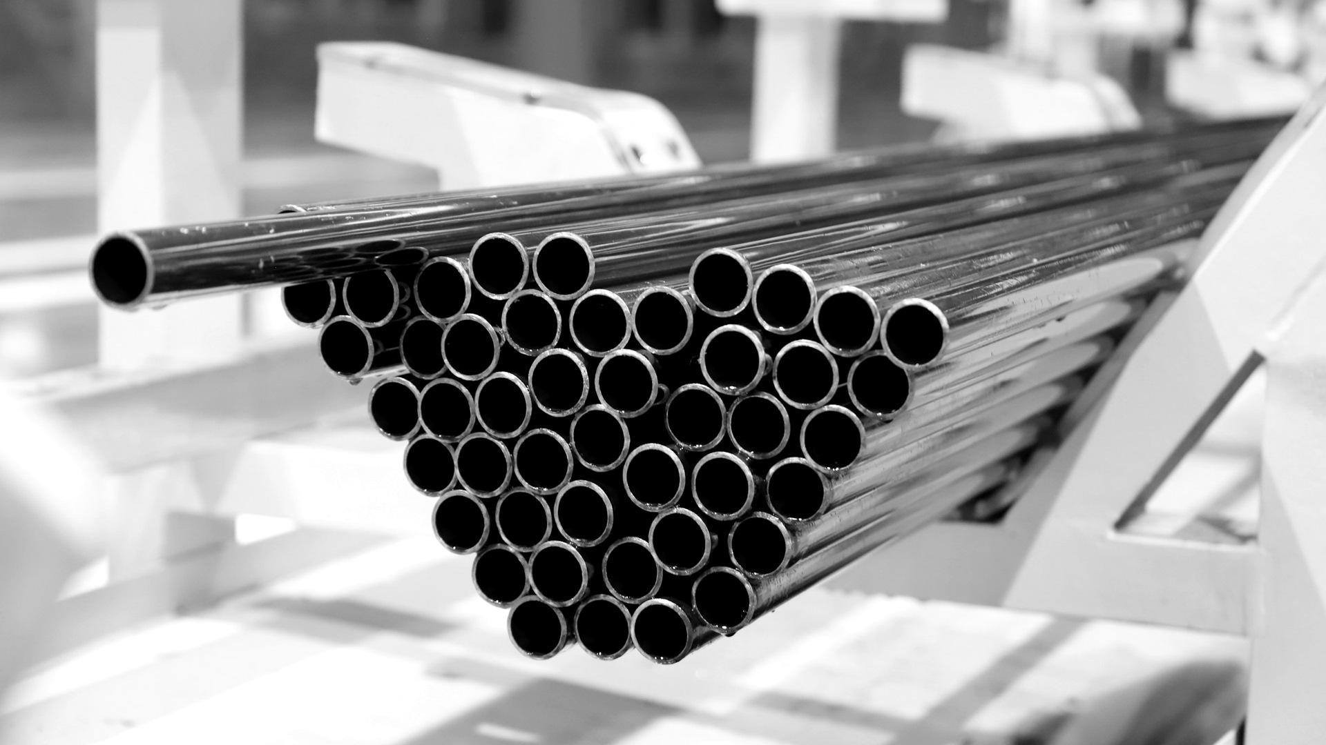 Stack of metal pipes on a factory line.